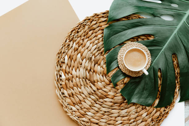 istock Top view coffee cup, monstera tropical leaf. Minimal background for bloggers 1316523866