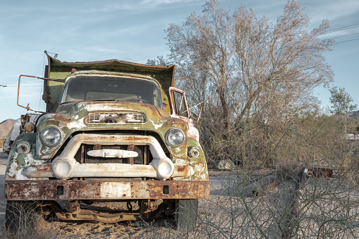 An old abandoned, broken down truck in the southwestern California desert.