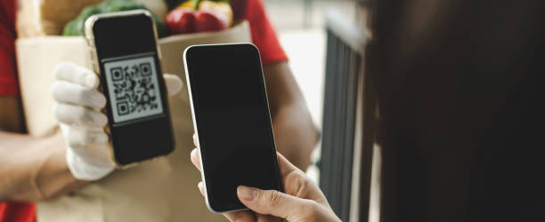 istock customer hand using digital mobile phone scan QR code paying for buy fresh food set bag from food delivery service man, express delivery, digital payment technology, fast food delivery concept 1316531283