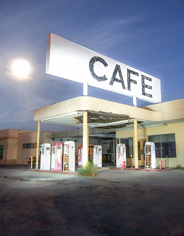 An abandoned and run down cafe/gas station in the California desert.
