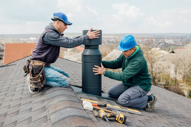 two Professional workmen's standing roof top and measuring chimney two Professional workmen's standing roof top and measuring chimney of new house under construction against blue background smoke stack stock pictures, royalty-free photos & images