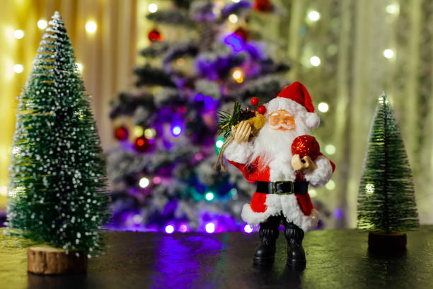 istock Santa Claus and Christmas trees, use as background 1316533811