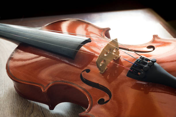 istock Wood violin on table, music instruments. 1316539285
