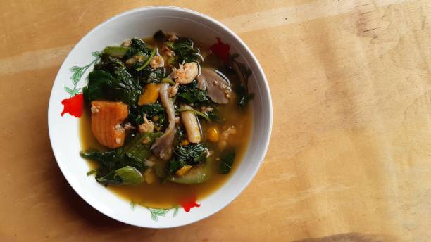 istock Thai spicy mixede vegetable soup with prawns(Gang liang goong).Thai food. 1316542913