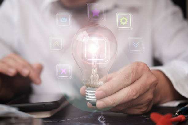 istock Businessman holding light bulb and business growth concept 1316547766