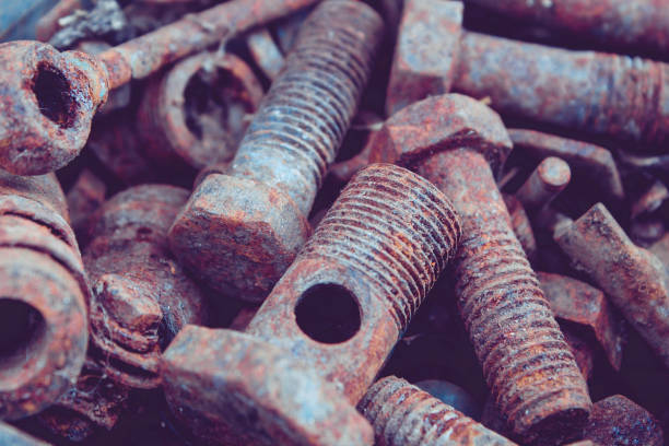 istock Old rusty bolts and nuts. Fasteners on the trash can. 1316547795