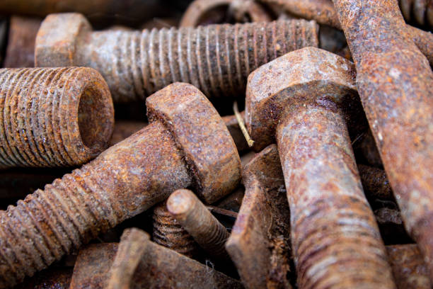 istock Old rusty bolts and nuts. Fasteners on the trash can. 1316547809