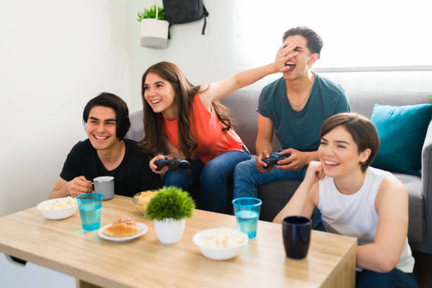 istock You are cheating! Friends gaming at home 1316549385