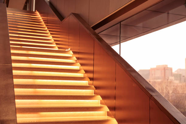 Interior stairs highlighted by lighting stock photo