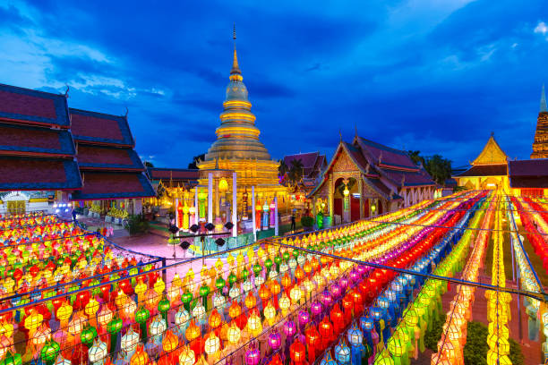 Scenic view of Colorful Lamp Festival and Lantern on Vesak day at Wat Phra That Hariphunchai in Lamphun near Chiang mai in twilight time, Thailand, Thailand culture stock photo