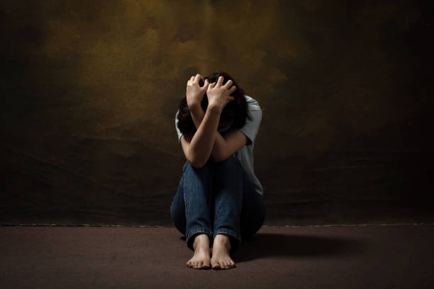istock desperate woman depression scratching her head while sitting on the floor 1316558378