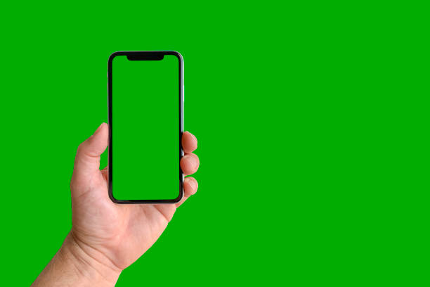 istock Man holding mobile phone, closeup of hand 1316560283