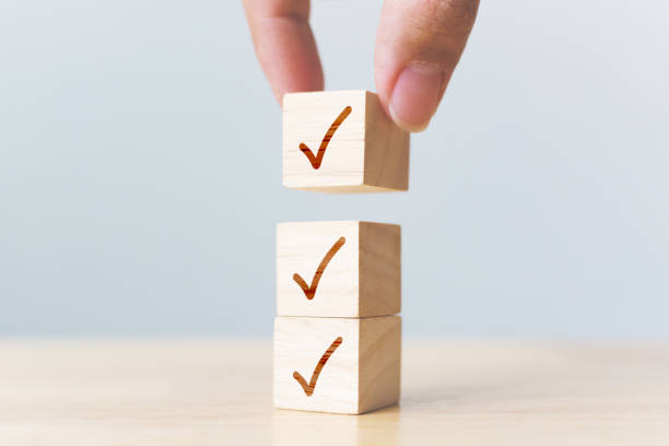 istock Checklist concept, Check mark on wooden blocks on table with copy space 1316560462
