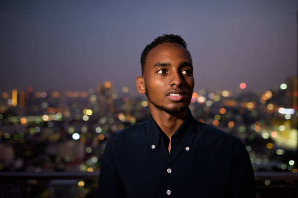 istock African businessman outdoors at rooftop at night smiling and thinking 1316562873