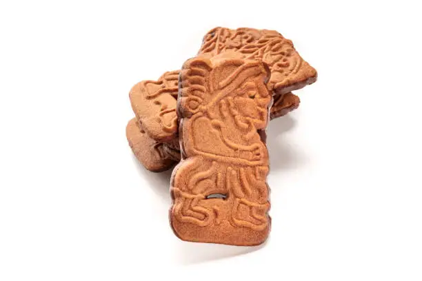 Speculoos or Spekulatius, traditional almond biscuits in a stack on a white background