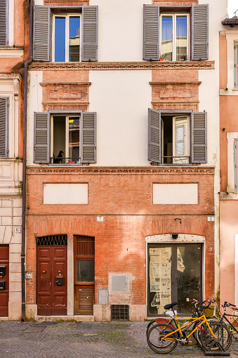 The facades of some ancient townhouses along Borgo Pio street, near the Vatican City and the square of the St. Peter's Basilica, one of the most frequented places by the millions of tourists who visit Rome every year. Image in high definition format.