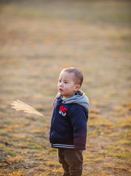 istock Cute small child playing in the park 1316567974