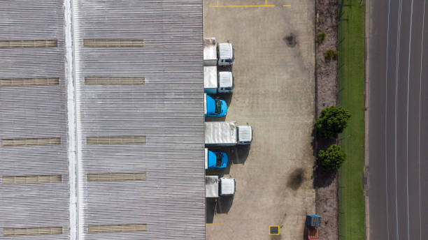 istock Aerial View of Delivery Trucks at a Loading Dock 1316567982