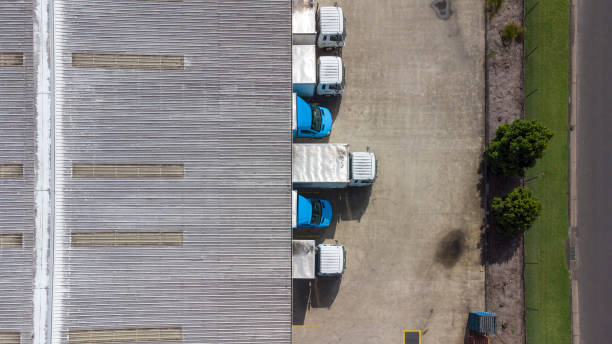 istock Aerial View of Delivery Trucks at a Loading Dock 1316567983