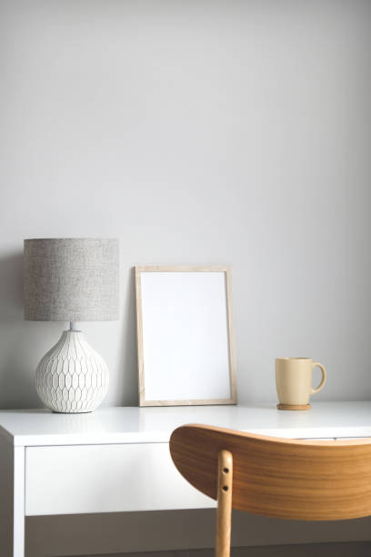 istock Empty wooden frame mockup on table in Scandinavian style living room interior. 1316568919