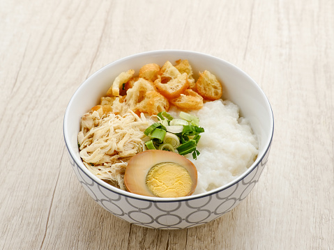 Bubur, Bubur Ayam, Indonesian rice porridge served with shredded chicken. Served with kerupuk (Cracker), Egg, Fried Soy Bean.