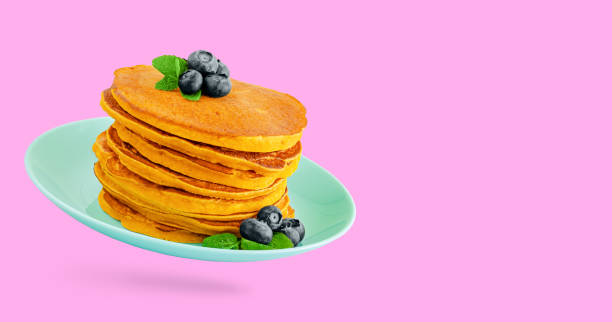 istock Heap of pumpkin pancakes with blueberries 1316570047