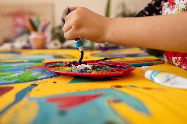 istock Girl painting tempera 1316570941