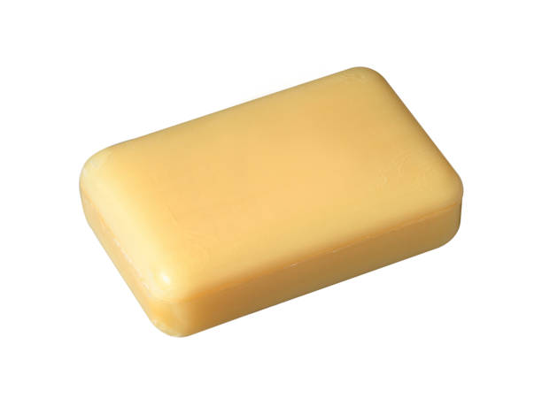 Bar of yellow soap isolated on white