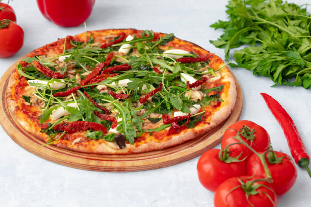 istock Freshly baked pizza on table close up 1316571515