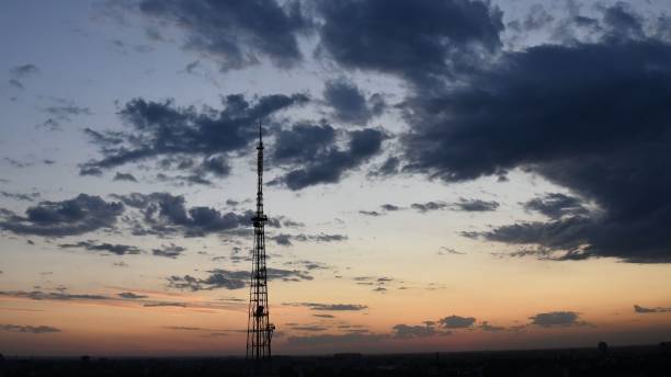 istock Blur silhouette of communication tower with dusk cloudscape skyline 1316572283
