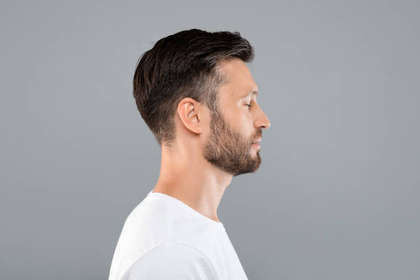 istock Side view of middle-aged man over grey background 1316572427