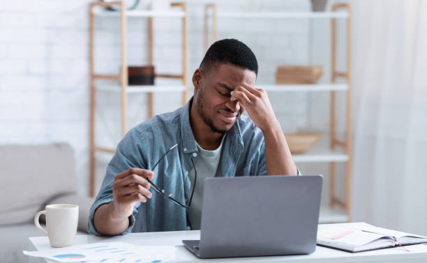 istock Man Having Eyes Fatigue Tired After Work On Computer Indoors 1316572544