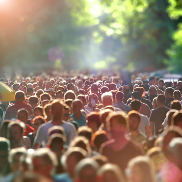 istock Crowd of people in a warm sunny day 1316573643