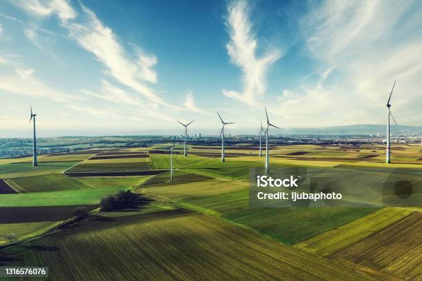 Photo Of Wind Turbines At A Rural Windfarm Stock Photo - Download Image Now - Wind Turbine, Wind Power, Windmill
