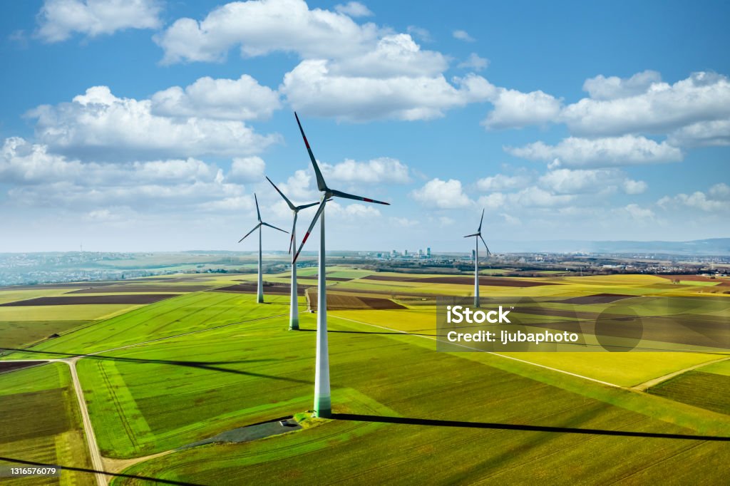 Sustainable power is the future Aerial drone view of wind turbines. Wind Turbine Stock Photo