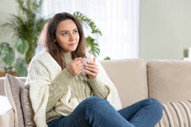 istock Young woman drinking a cup of coffee 1316576458