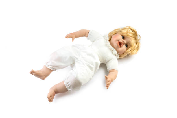 istock Cute old toy doll isolated against white background 1316577397
