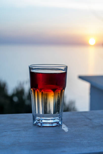 istock coca cola drink and sprite on the counter at sunset, lockdown 1316577533