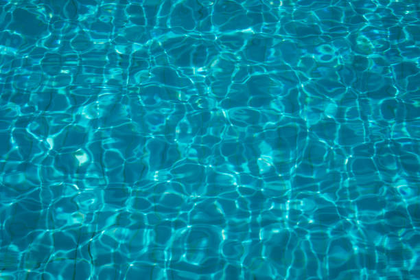 istock blue deep pool from above on a sunny day, background
