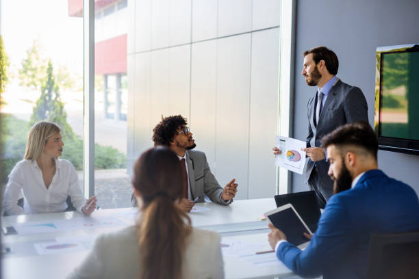istock Business team working together on meeting, analyzing financial documents in office 1316580430