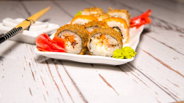istock Sushi, rolls on a white plate close-up, copy space, template 1316581080