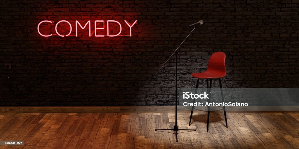 stage with microphone and stool with red neon lamp with the word COMEDY. space for text stage with microphone and stool illuminated by a spotlight with the word COMEDY on a red neon lamp and brick wall. . space for text. 3d render Comedian Stock Photo