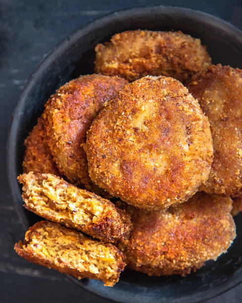 istock Vegetables patties or cutlets on a black plate. Top view 1316581334