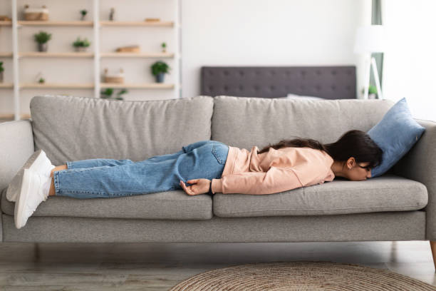 istock Exhausted Sleepless Young Woman Lying On The Couch 1316582874