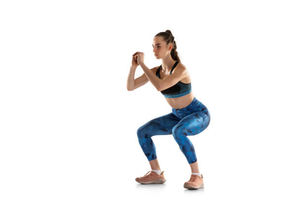 istock One woman female athlete training isolated over white studio background. 1316583156