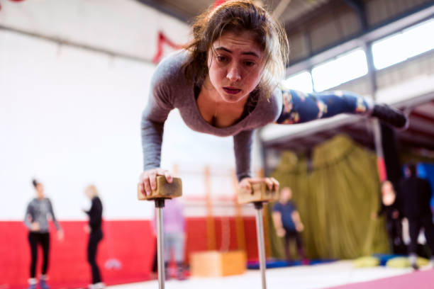 istock Concentrated female acrobat standing on arms 1316584221