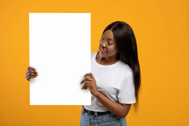 istock Cheerful african american lady showing empty placard 1316584863