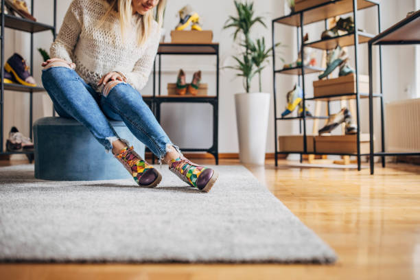 istock Woman buying shoes 1316585421