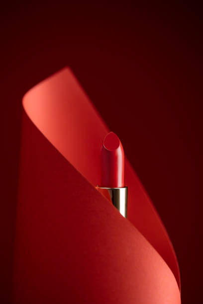 istock Classic red lipstick in a gold case 1316585423