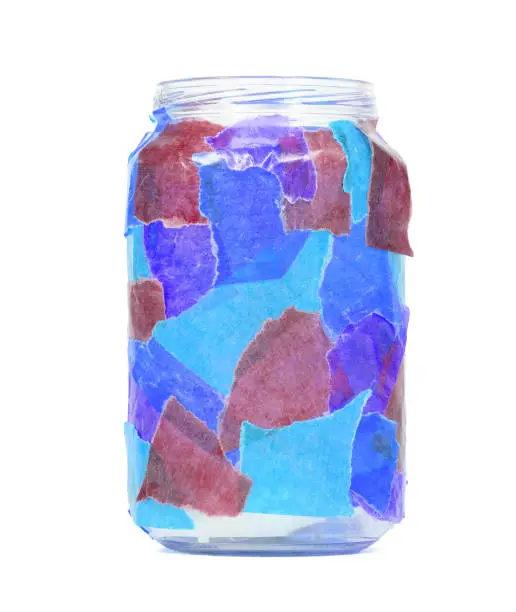 Jar decorated with colorful paper, tealight, isolated
